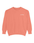 pale orange crewneck sweatshirt with word Californian printed on left